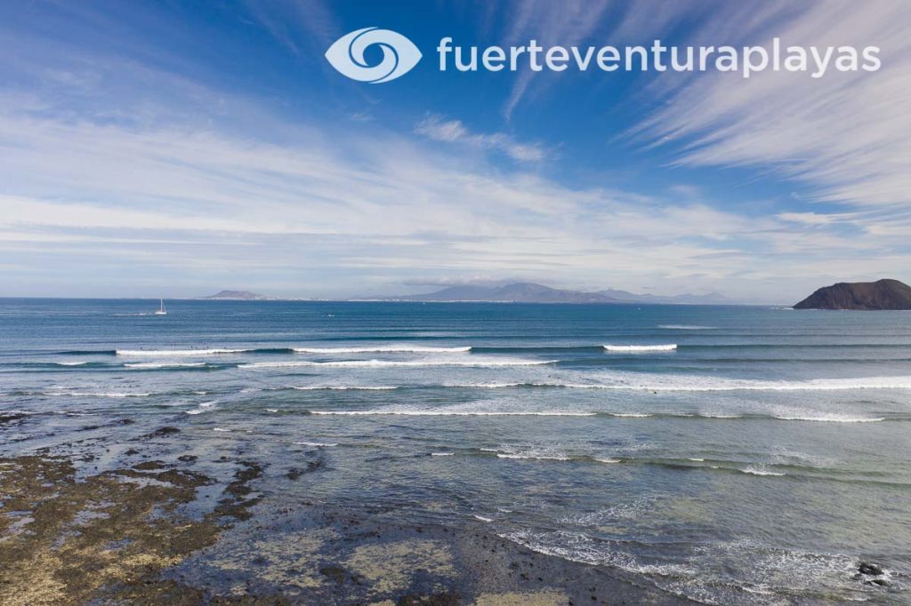 Surfing at Rocky Point, also known as Punta Elena, in the bay of Corralejo, northeast Fuerteventura.